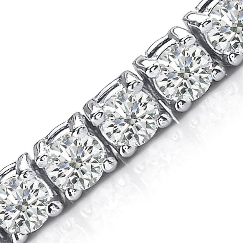 14k white gold tennis bracelet with 64 round brilliant diamonds totaling 2.67 cts