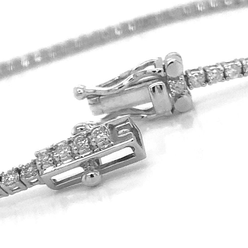 18k white gold tennis bracelet with 79 round brilliant diamonds totaling 1.50 cts