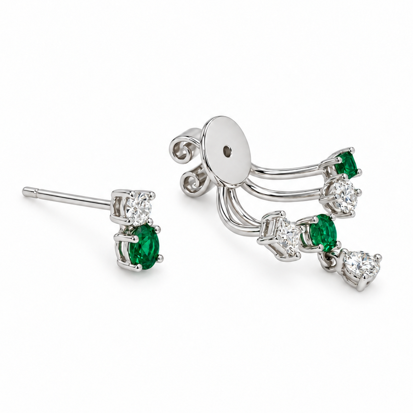 Close-up of green tsavorite garnets and round diamonds on an 18k white gold ear jacket