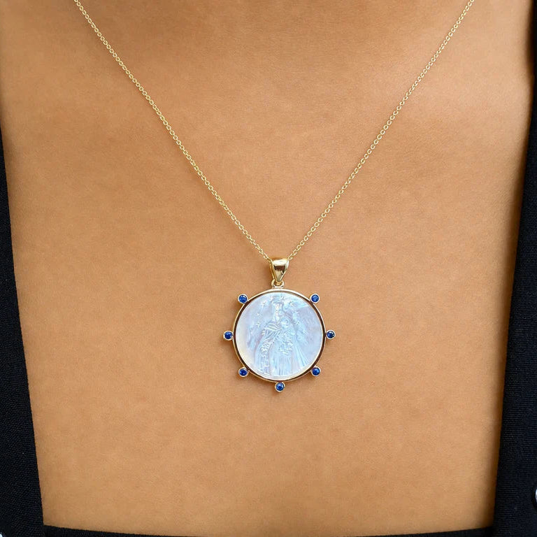 18k yellow gold medal pendant with mother-of-pearl center and diamond halo