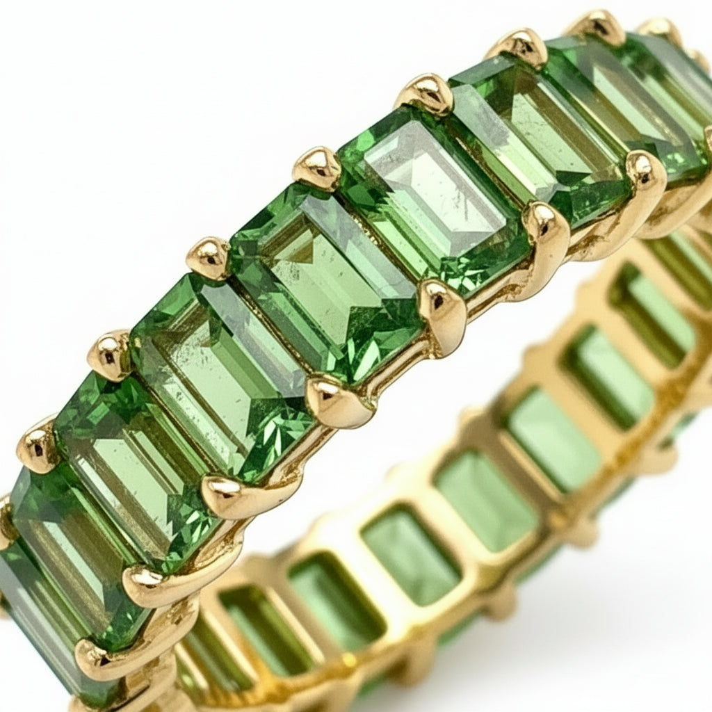 18k gold half band ring with 2.7 ctw emerald-cut tsavorite garnets by Diamond Tales