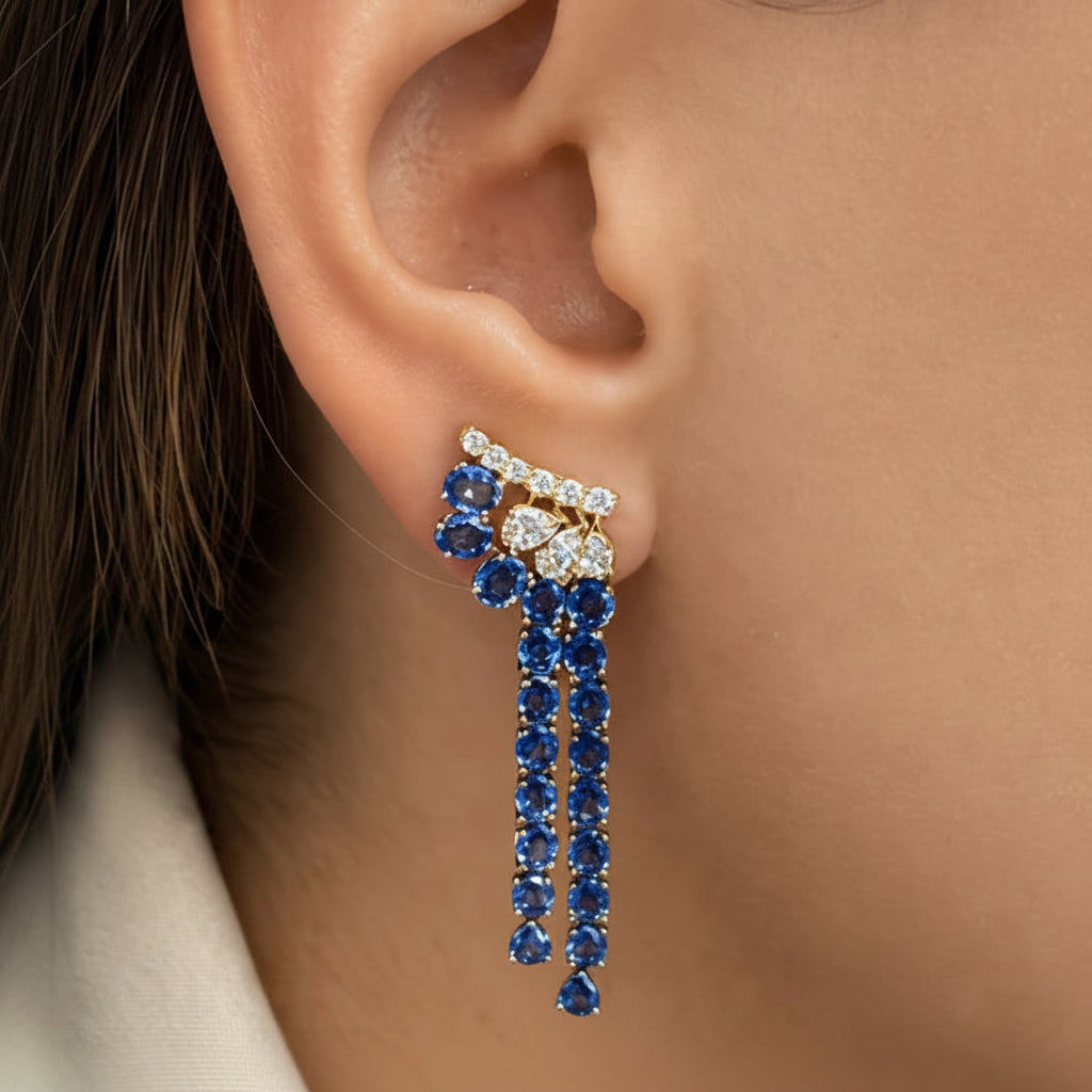 Twin-strand drop earrings in 18k yellow and white gold with blue sapphires and diamonds by Diamond Tales