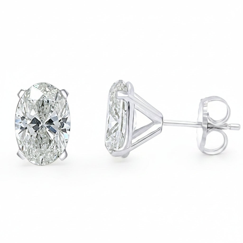Platinum oval diamond stud earrings with 4.06 cts total GIA-certified diamonds