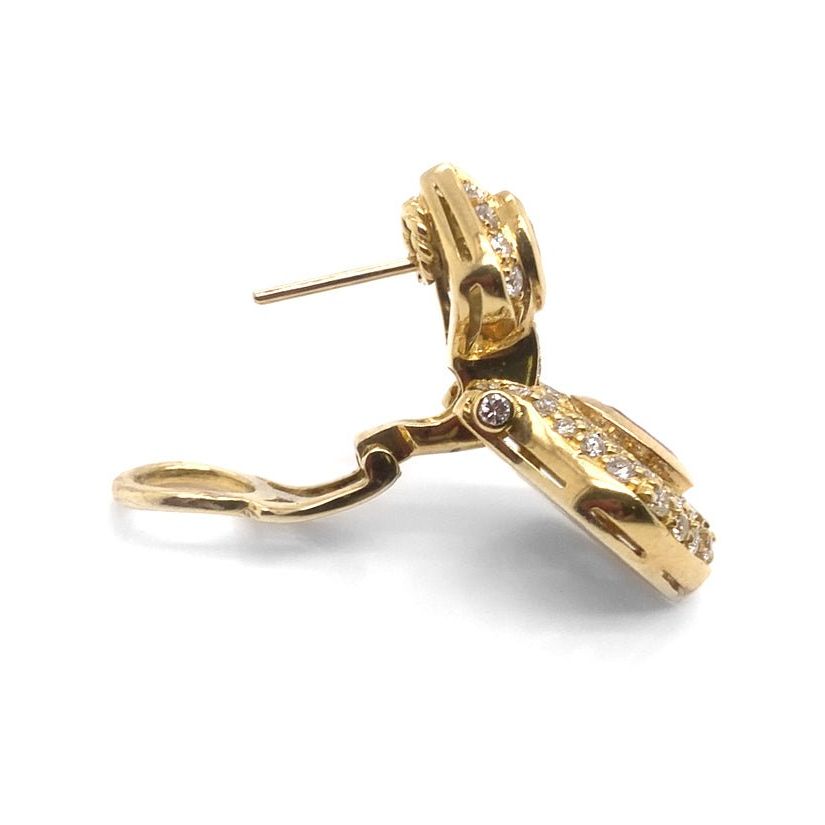 18k gold earrings with sapphire centers in a halo of diamond accents