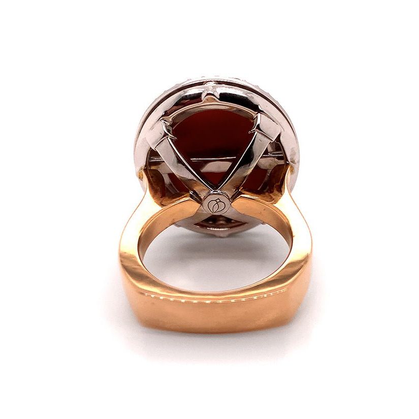18k gold ring with coral cabochon and round diamond accents
