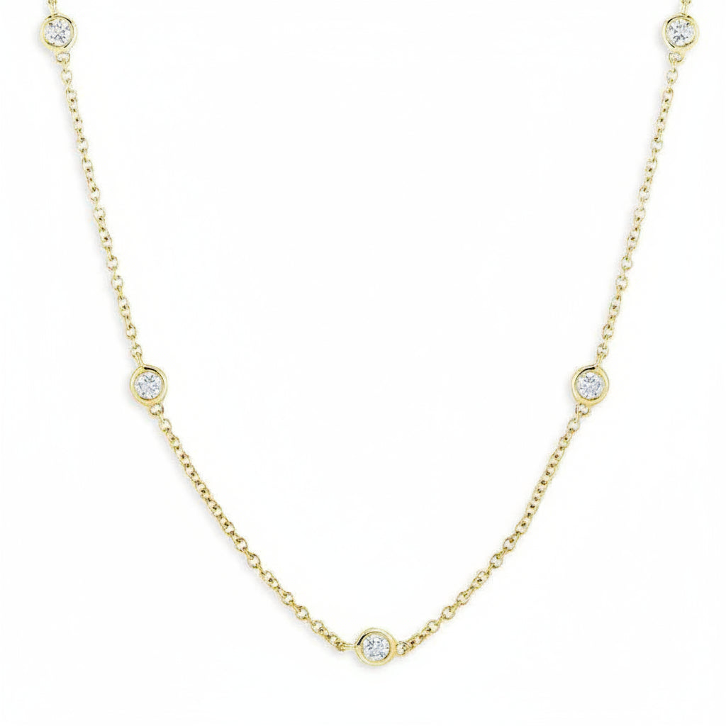 18k yellow gold Diamond by the Yard necklace with bezel-set diamond stations on a fine chain