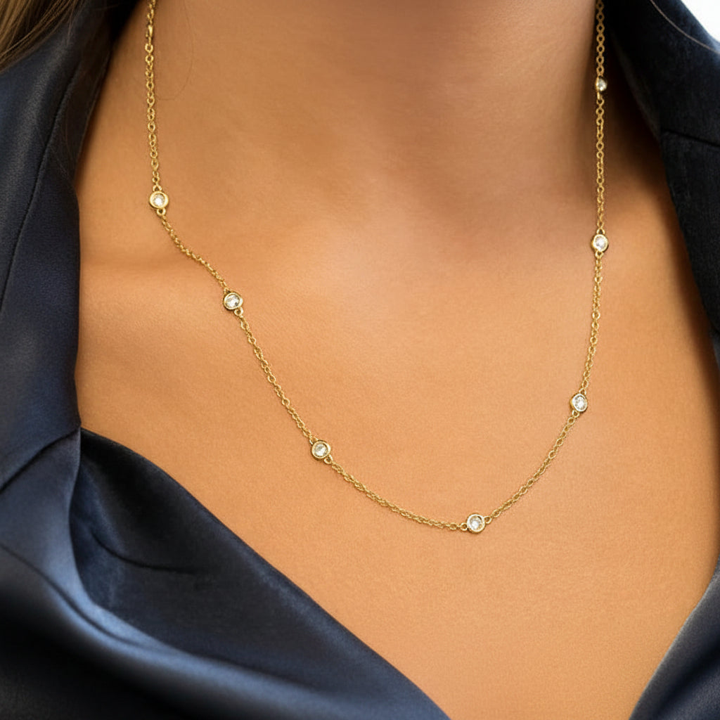 18k yellow gold Diamond by the Yard necklace with bezel-set diamond stations on a fine chain