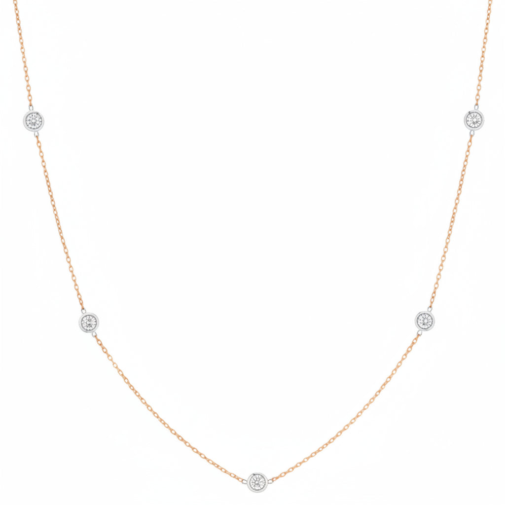 18k rose gold necklace with evenly spaced bezel‑set diamonds on a 24‑inch chain