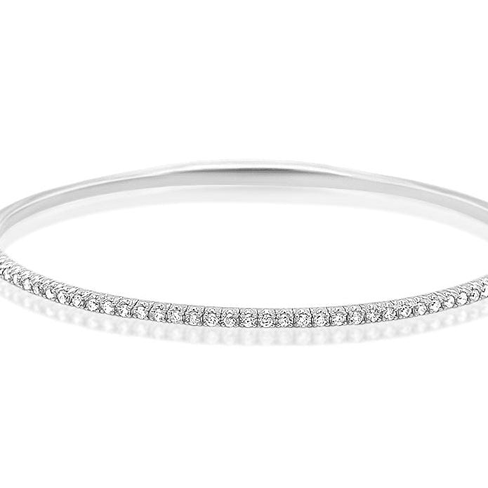 14k white gold tennis bangle bracelet with 0.55 carats of round brilliant-cut diamonds