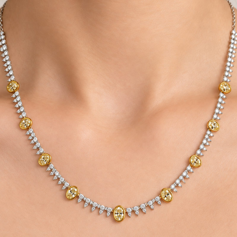 Yellow and white diamond tennis necklace in 18k gold, worn at the collarbone
