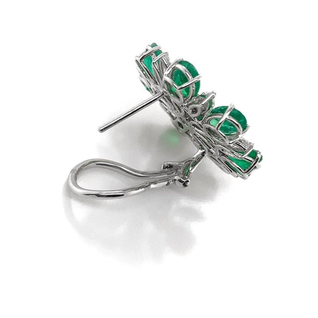18k white gold flower earrings with emerald petals and diamond accents