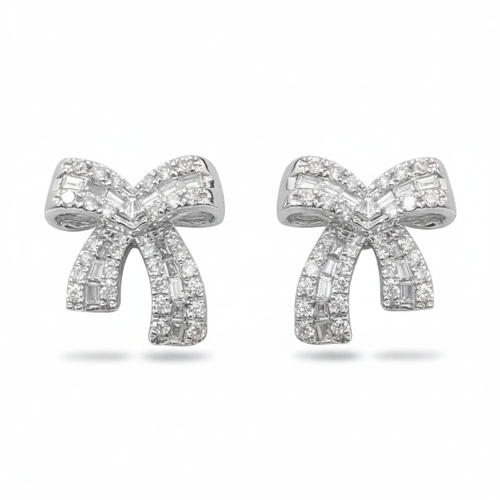 18k white gold bow stud earrings with diamond accents totaling 0.34 cts