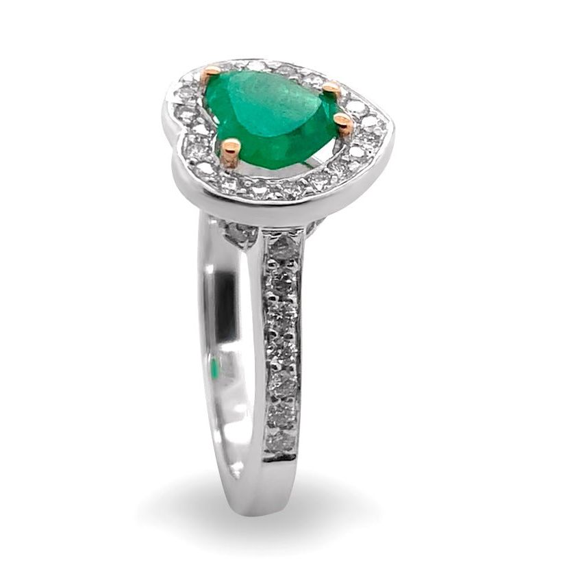 18k gold ring with a heart-shaped emerald surrounded by diamonds