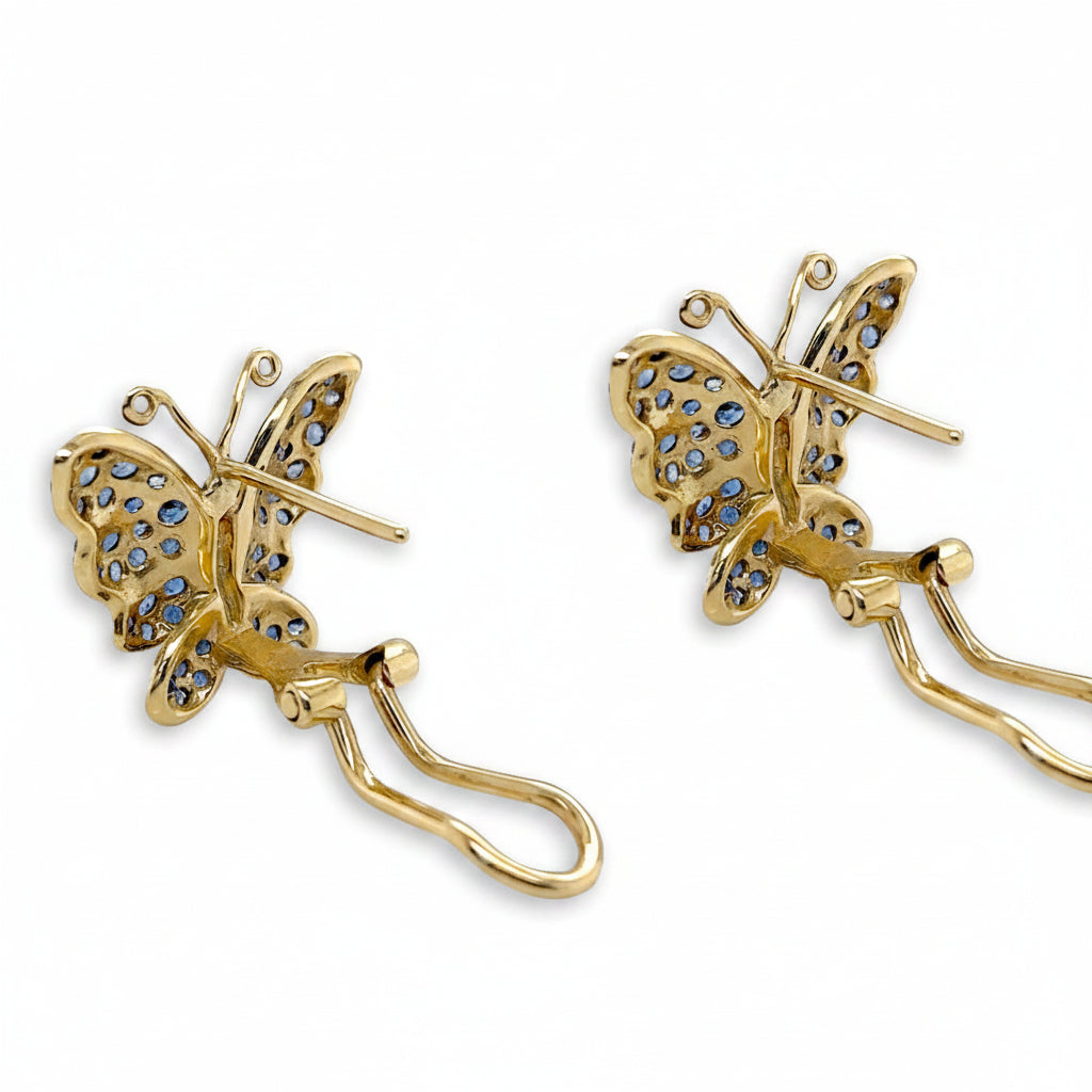 18k white and yellow gold butterfly stud earrings set with pavé blue sapphires and diamond accents