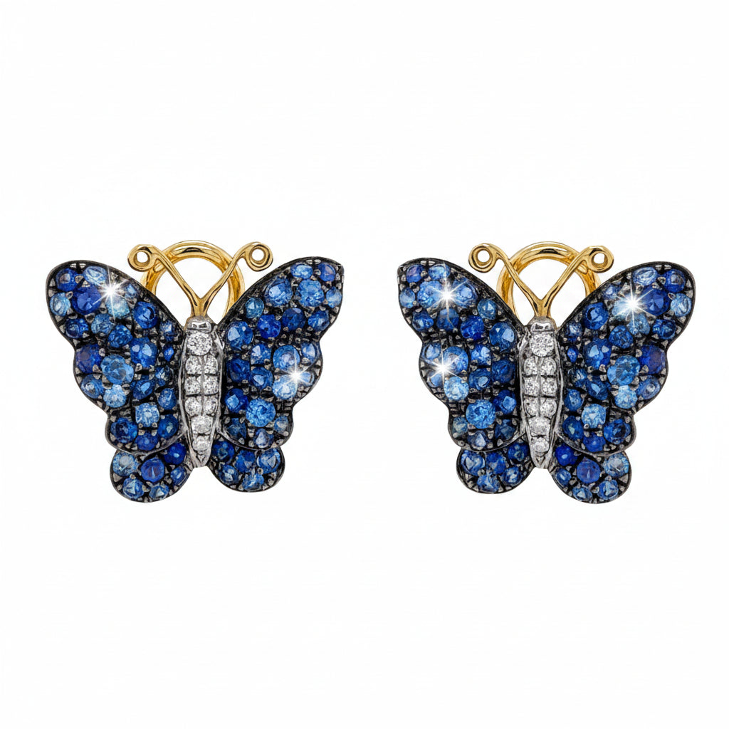 18k white and yellow gold butterfly stud earrings set with pavé blue sapphires and diamond accents
