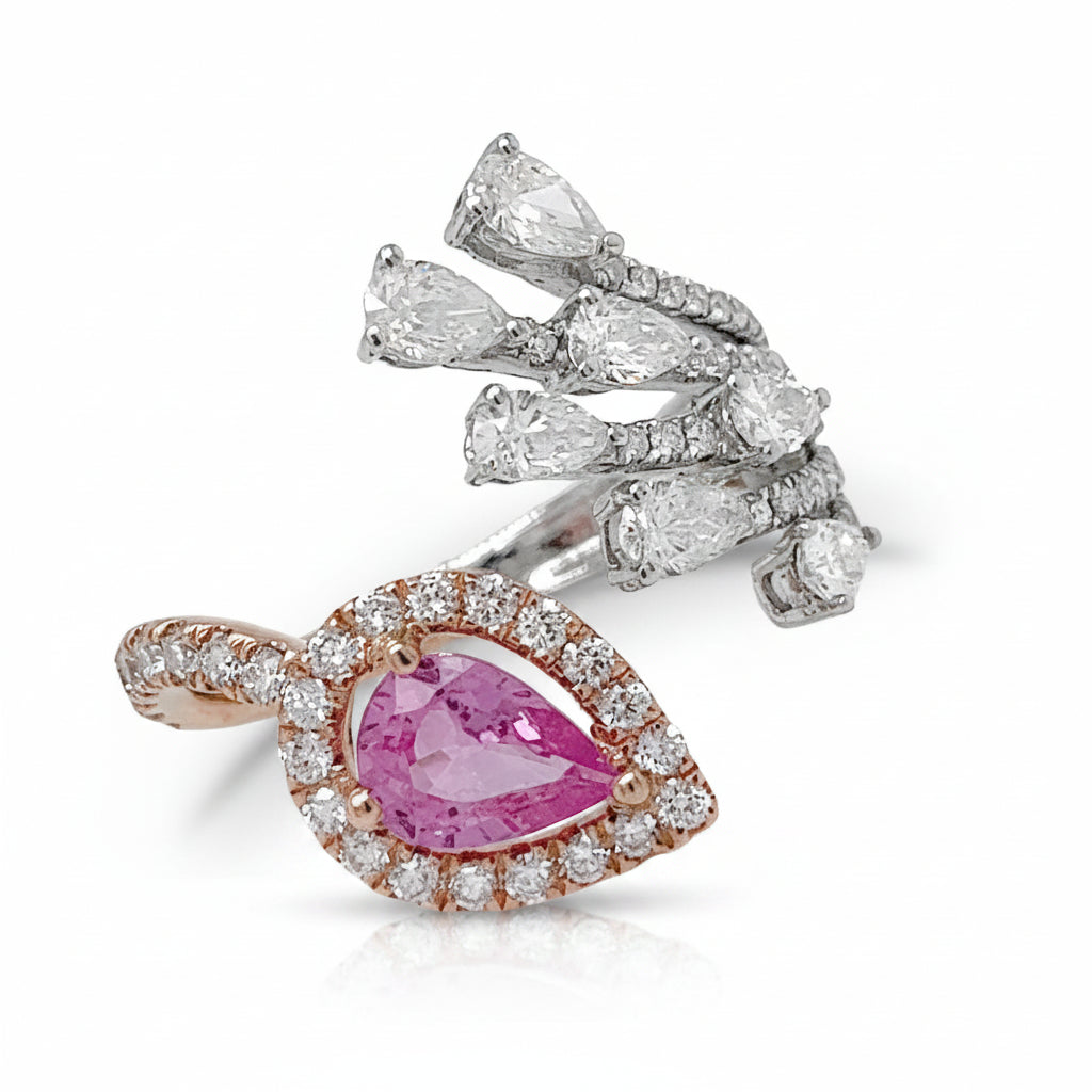18k white and rose gold open band ring with a pear-shaped blue sapphire and diagonal diamond accent