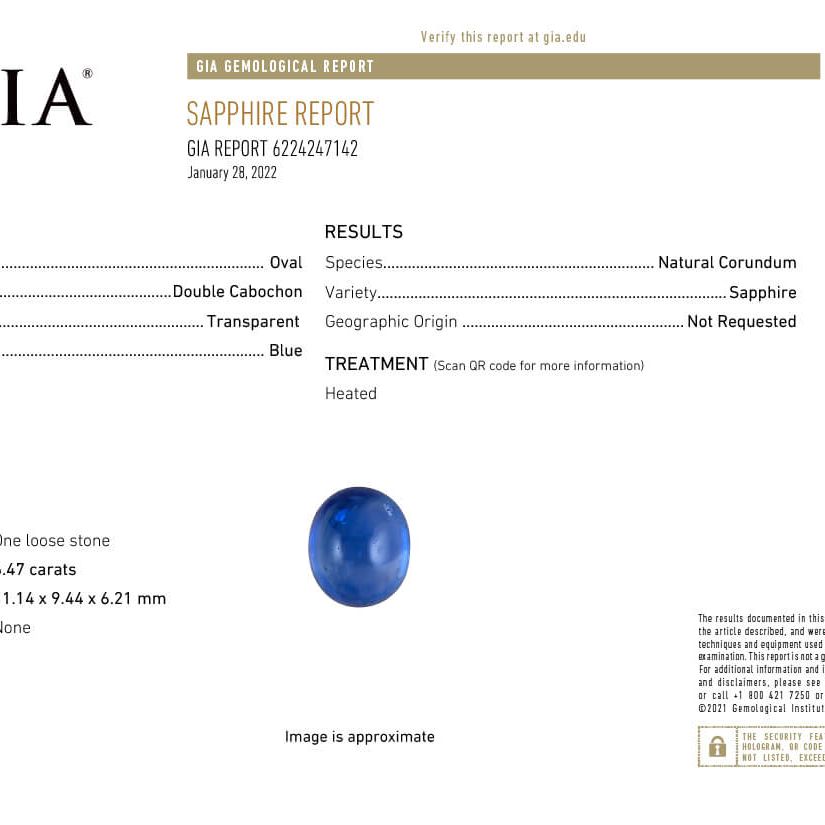 18k gold ring with oval blue sapphire double cabochon and diamond halo