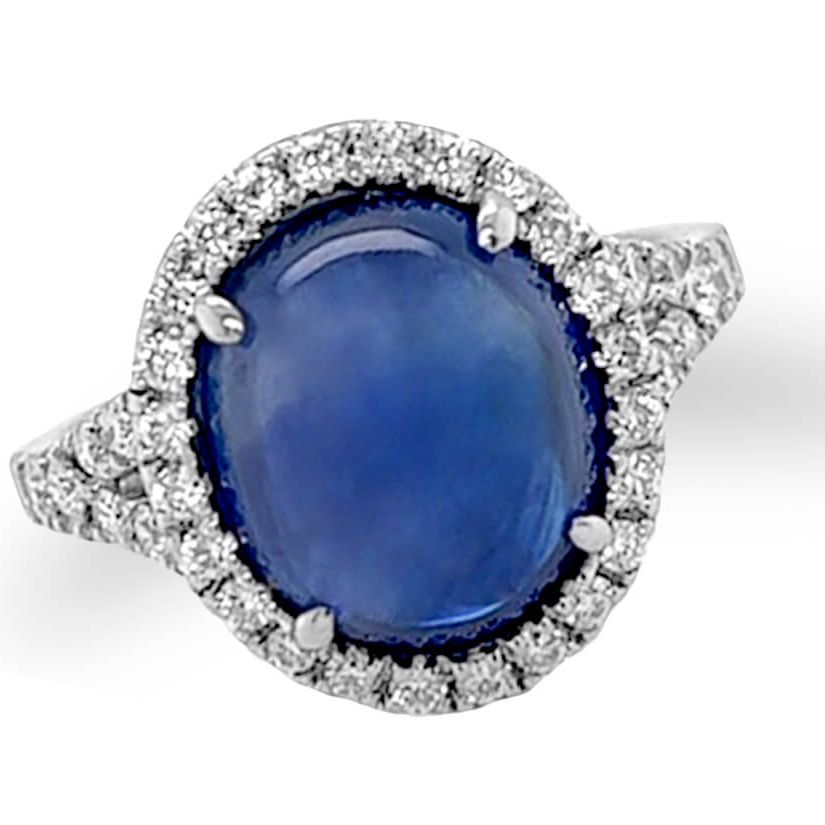 18k gold ring with oval blue sapphire double cabochon and diamond halo