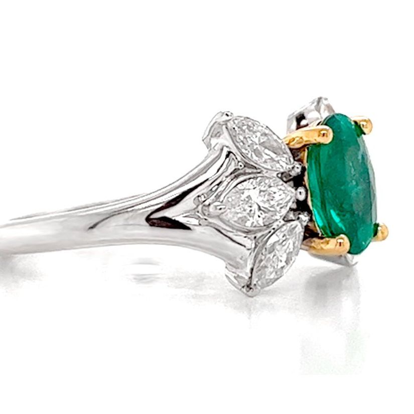 18k gold ring with oval emerald and marquise diamond side stones