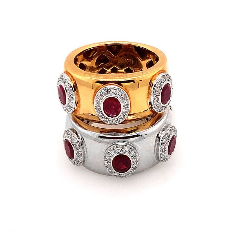 18k gold ring with three oval rubies (1.14 cts) and round diamonds (0.38 cts)