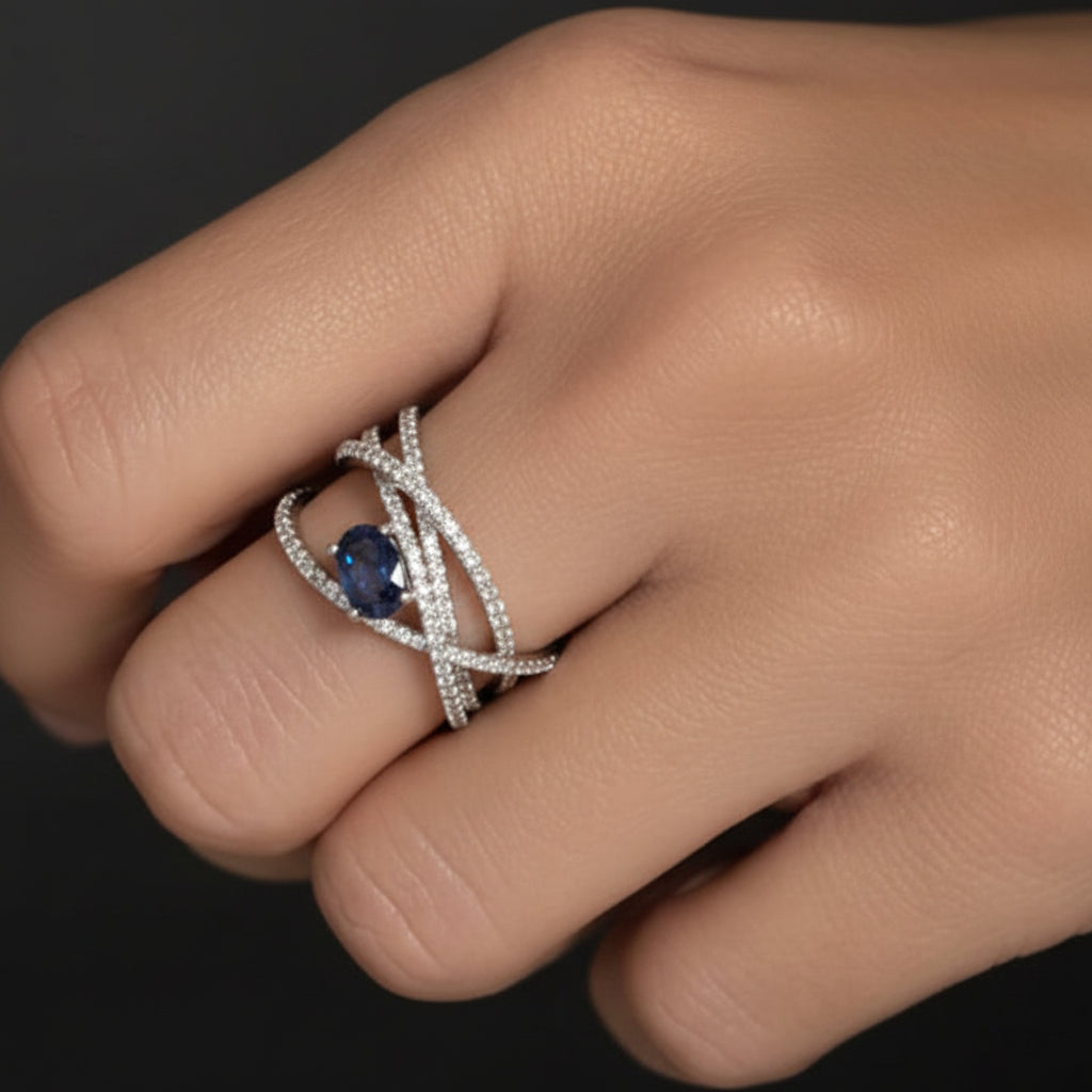 oval sapphire and diamond criss cross ring in 14k gold