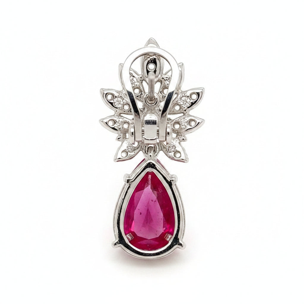 18k white gold drop earrings with pear rubies and brilliant‐cut diamond accents