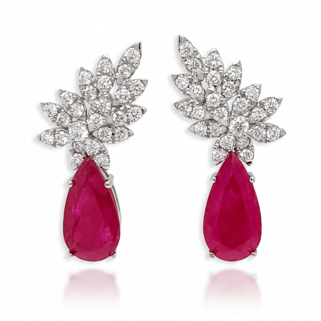 18k white gold drop earrings with pear rubies and brilliant‐cut diamond accents