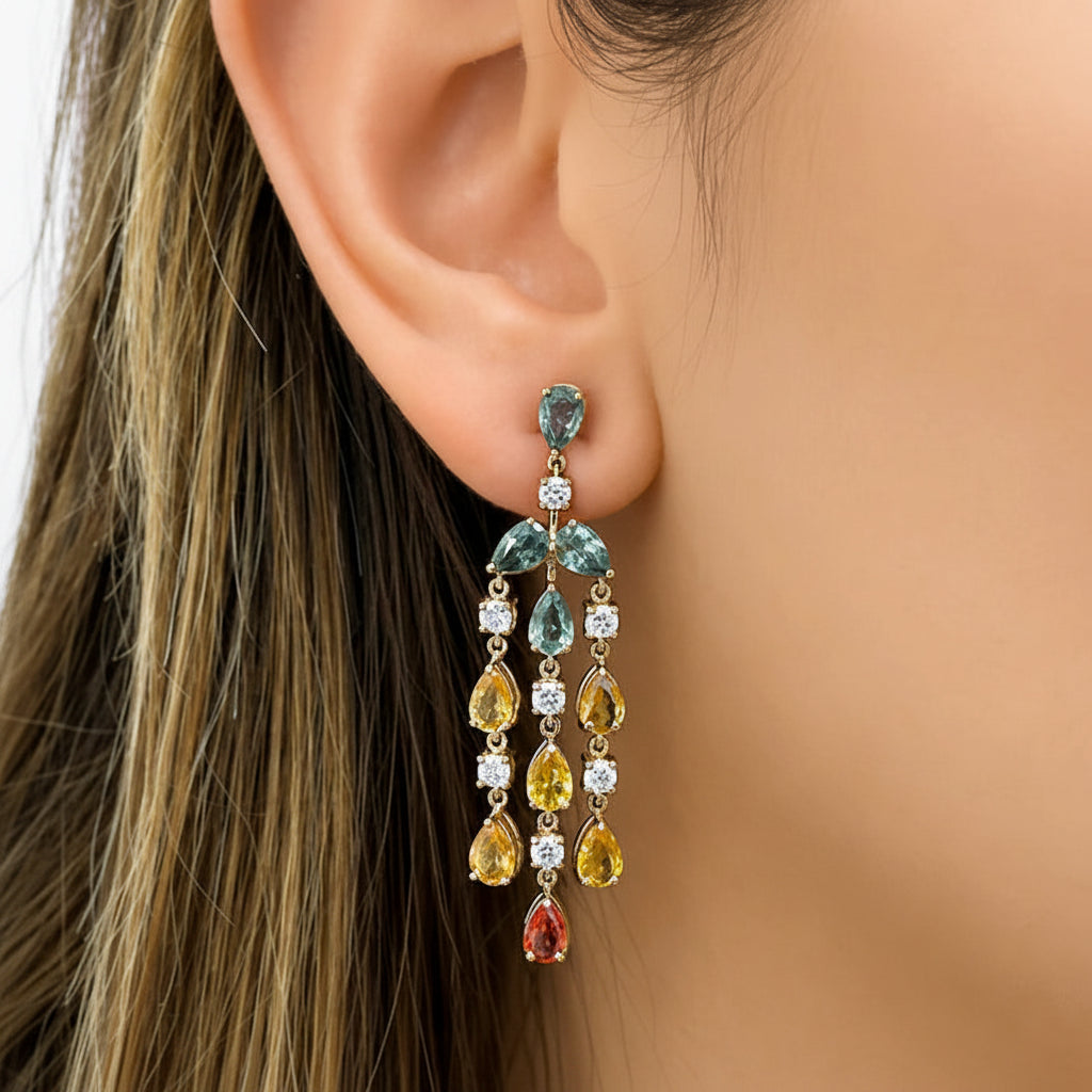 18k gold chandelier earrings with pear sapphire tiers and round diamond accents