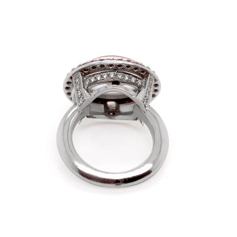 18k white gold ring with pink quartz, blue sapphires, and diamond accents