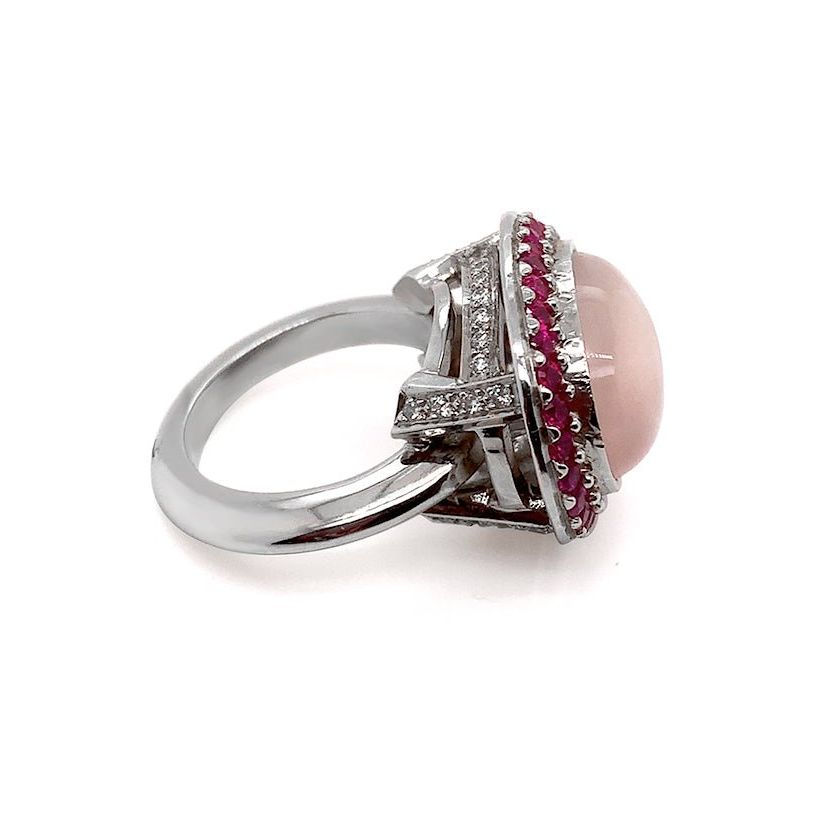 18k white gold ring with pink quartz, blue sapphires, and diamond accents