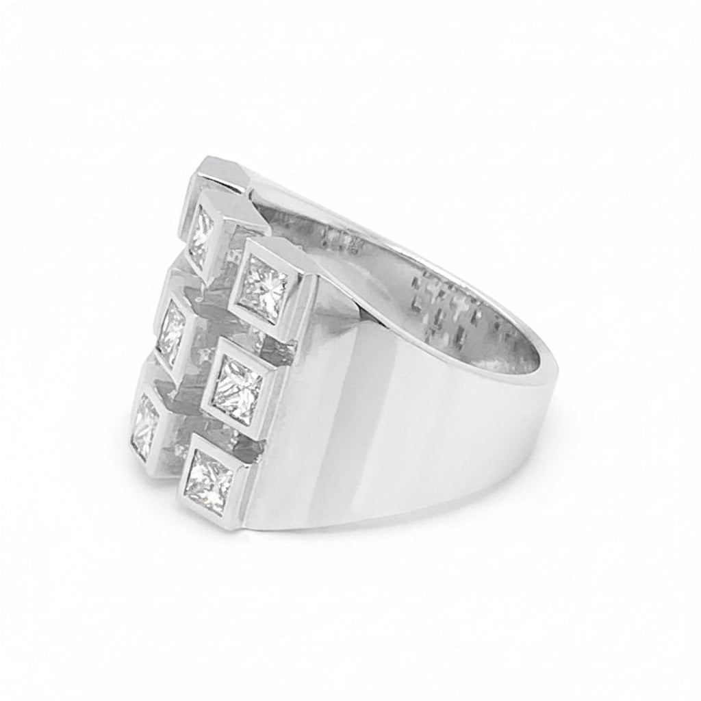 18k white gold ring with nine princess cut diamonds totaling 1.15 cts