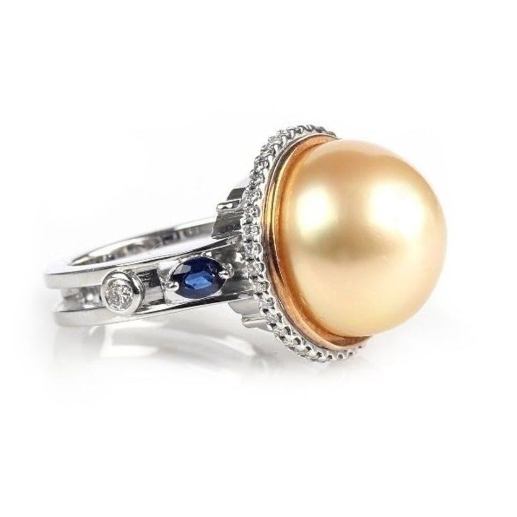 18k gold ring with South Sea golden pearl, pavé diamonds, and blue sapphire accents