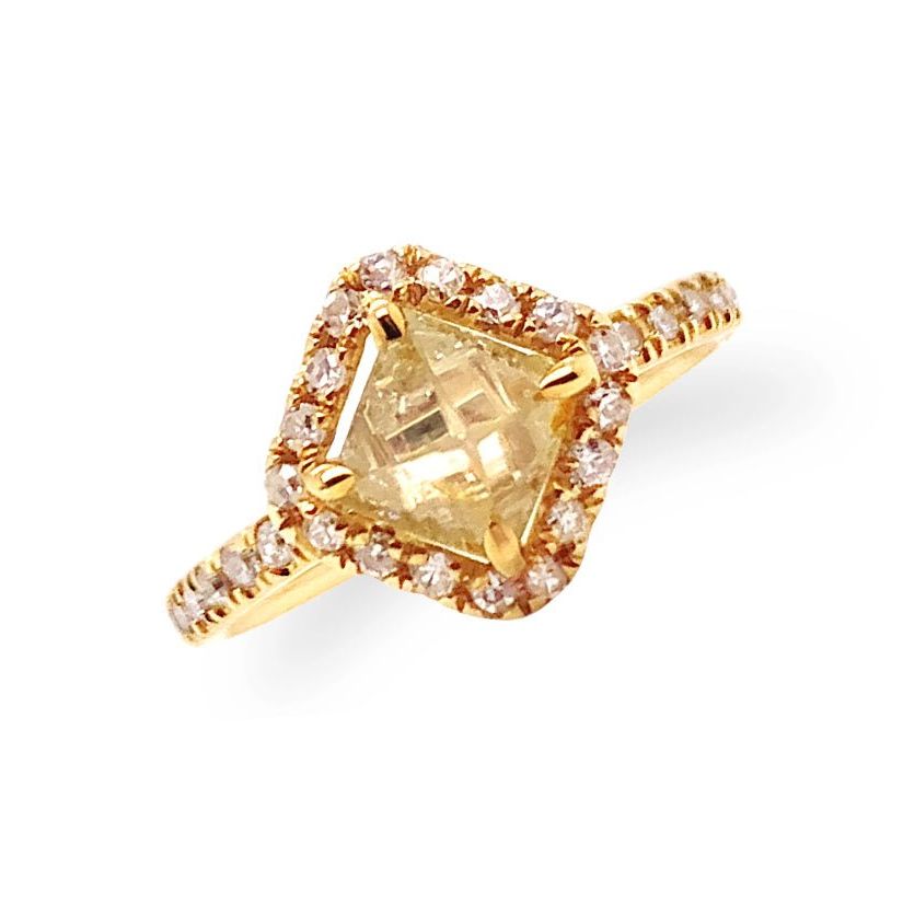 18k yellow gold ring with a rough diamond and small diamond accents