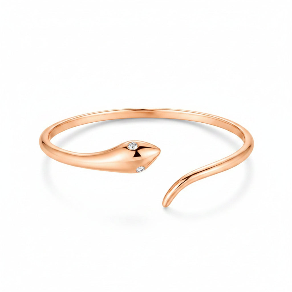 14k rose gold ring shaped as a coiled snake with diamond-set eyes