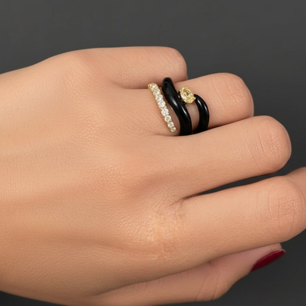 18k yellow gold open spiral ring with black agate ends and brilliant-cut diamonds totaling 0.71 carats