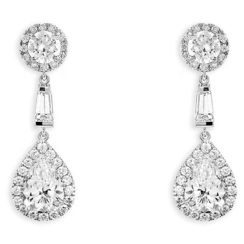 18k gold earrings with GIA pear-shaped diamonds and diamond halo dangles