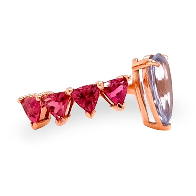18k gold ring with pear sapphire and trillion-cut rubellite in a bypass design