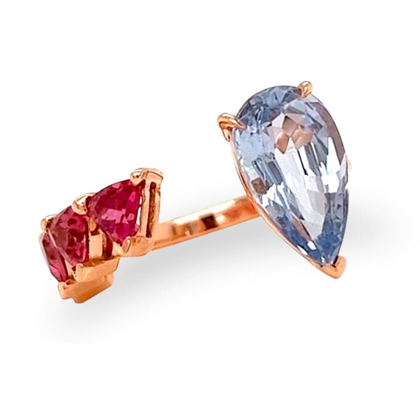 18k gold ring with pear sapphire and trillion-cut rubellite in a bypass design