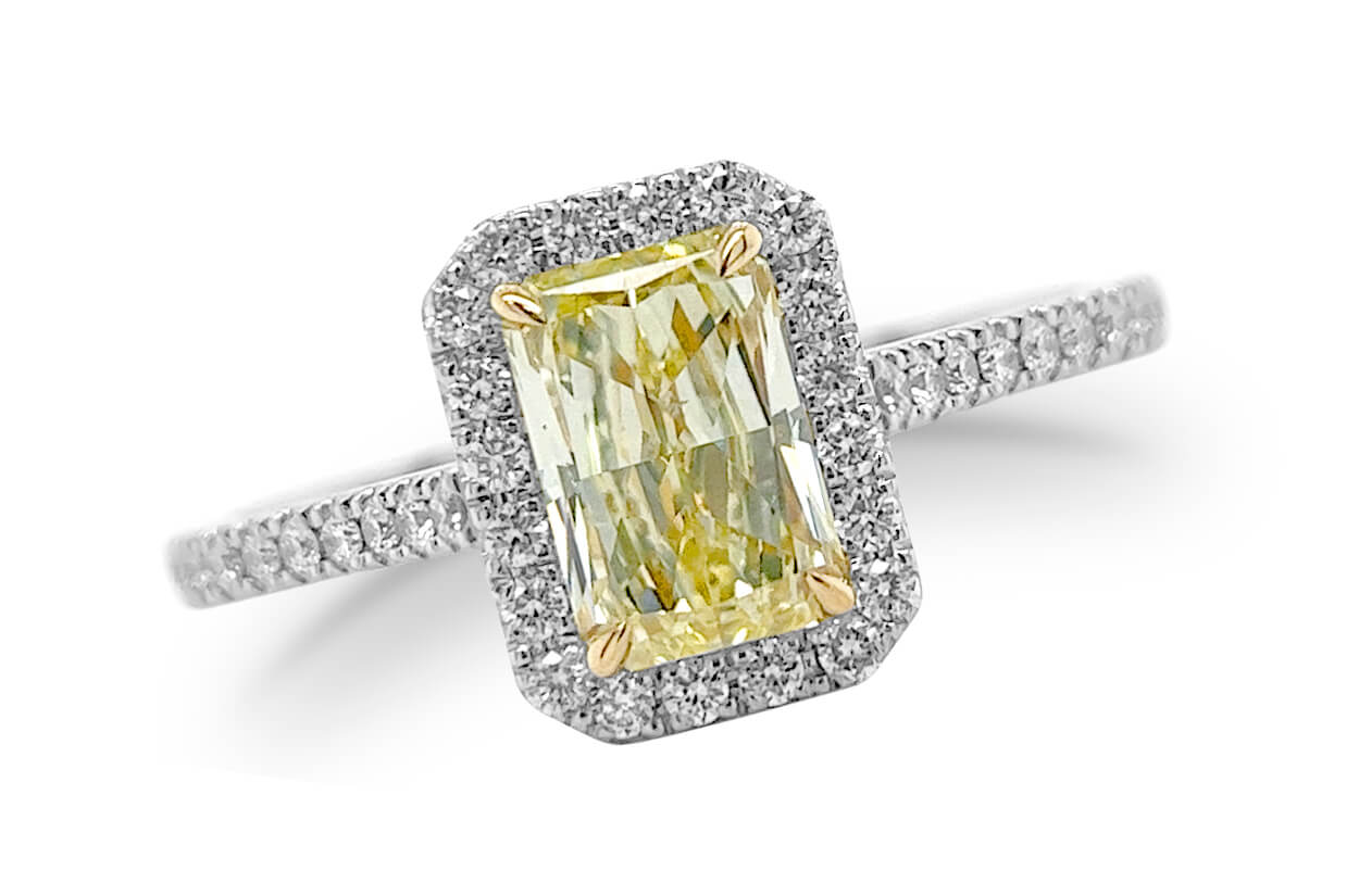 Fancy Yellow Diamond Engagement Ring on a Halo Setting with a Pavé Diamonds Band