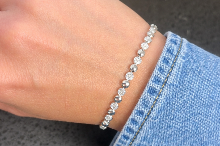 14k white gold bracelet with 147 round brilliant diamonds totaling 0.66 ctw by Diamond Tales
