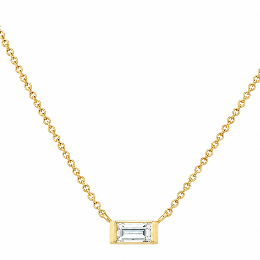 14k yellow gold necklace with a 0.20 ct emerald-cut diamond pendant