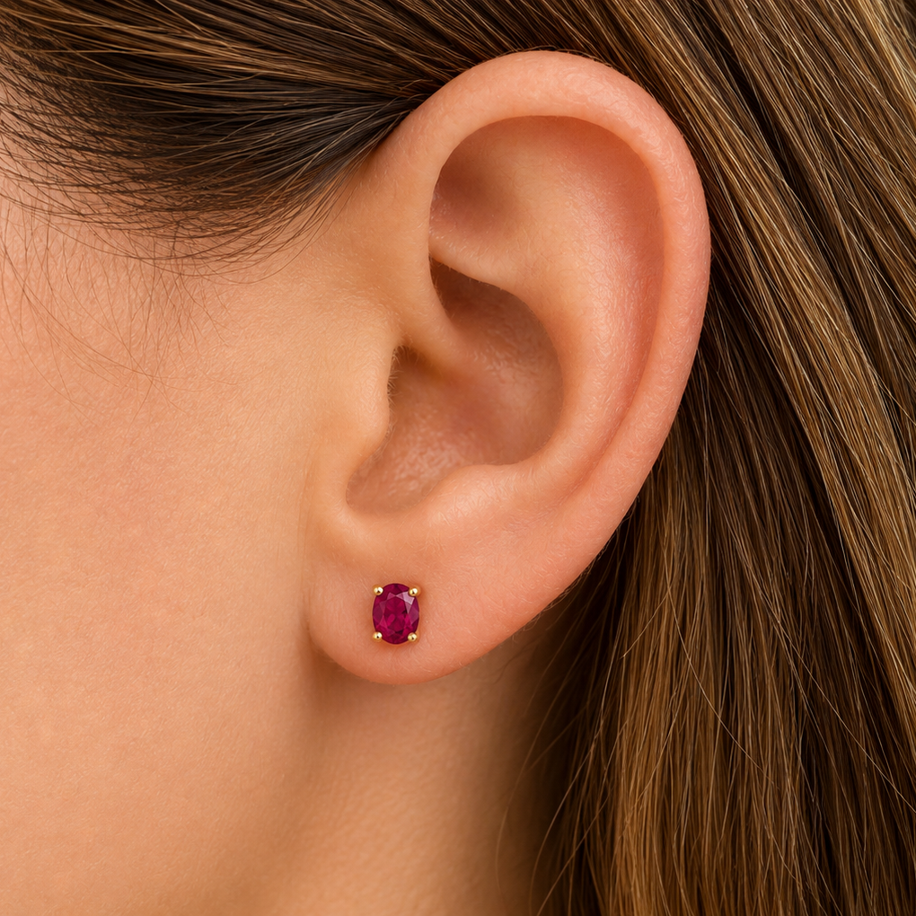 14k gold oval ruby mini stud earrings with 0.60 cts rubies