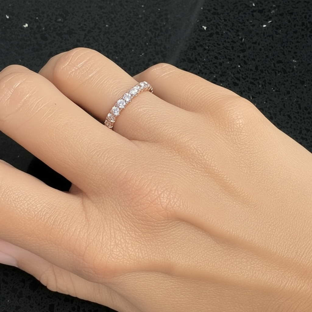 model wearing 14k rose gold pink lab diamond eternity band