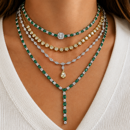 model wearing 14k white gold fancy light yellow diamond pendant necklace and emerald necklaces
