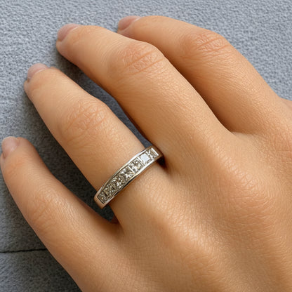 14k white gold half-band ring with seven channel-set diamonds totaling 1.02 cts