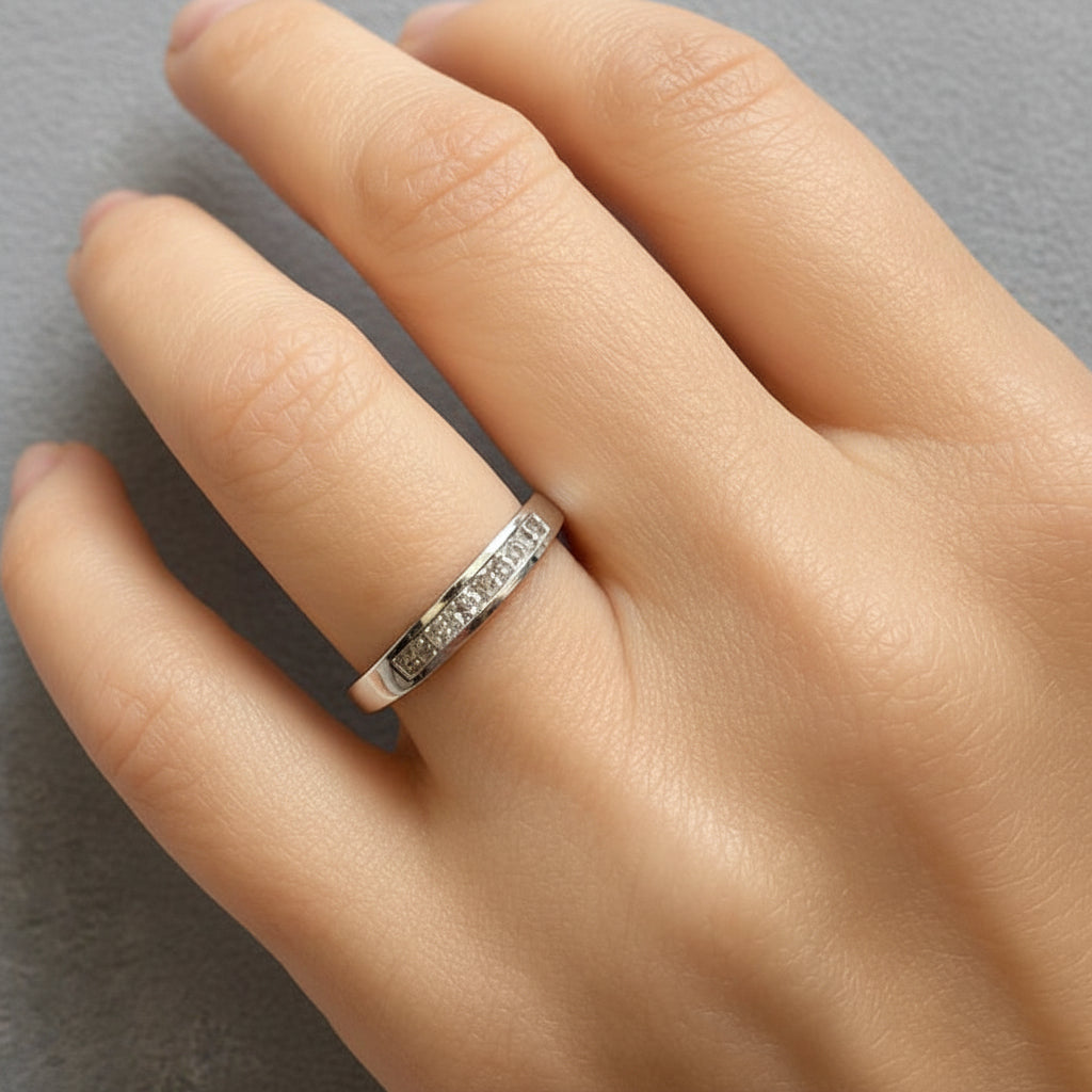 14k white gold half-band ring with nine channel-set diamonds totaling 0.30 cts