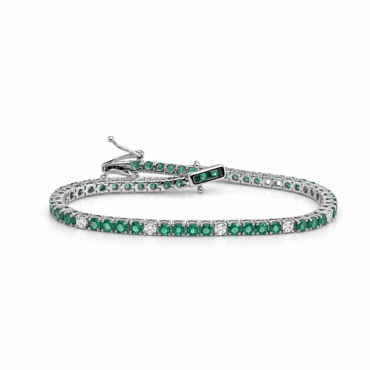 14k white gold tennis bracelet with 48 natural emeralds and 12 diamonds