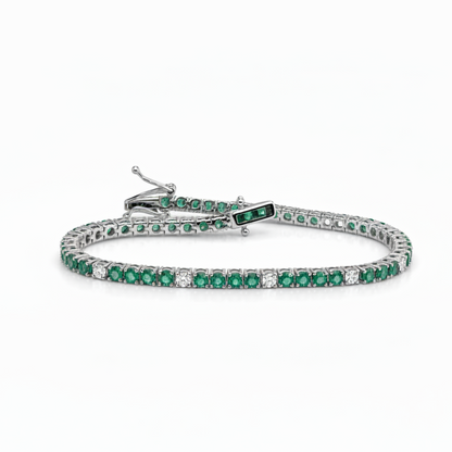 14k white gold tennis bracelet with 48 natural emeralds and 12 diamonds