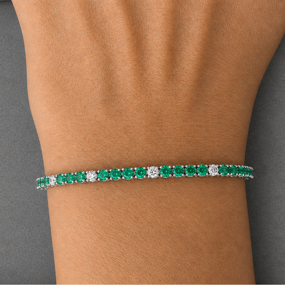 natural emerald and diamond tennis bracelet in 14k white gold close up detail