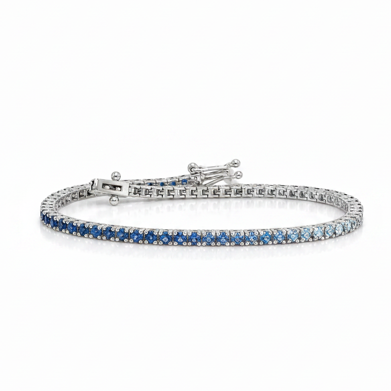 14k white gold tennis bracelet with gradient of natural blue sapphires